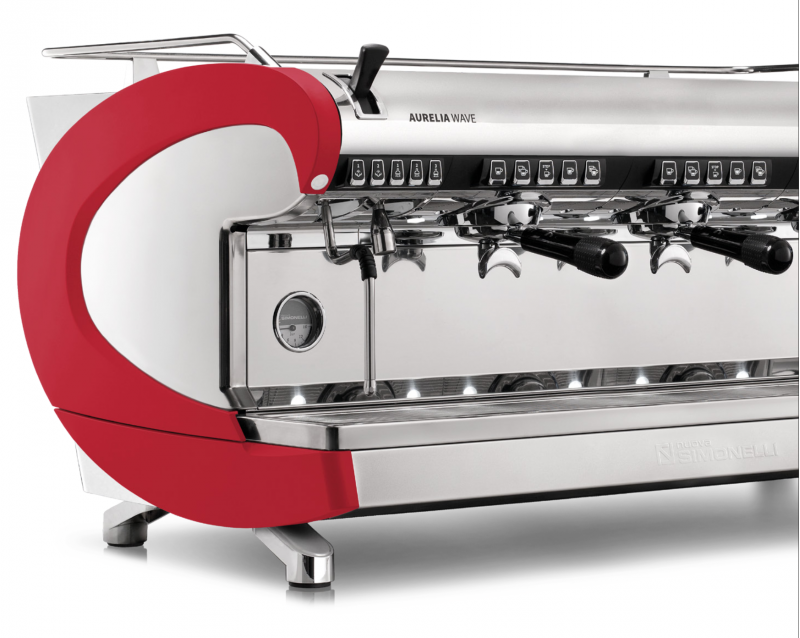 A closeup front/side view of the 3 group Aurelia Wave T3 in red, with Volumetric dosing, and tall brew groups.